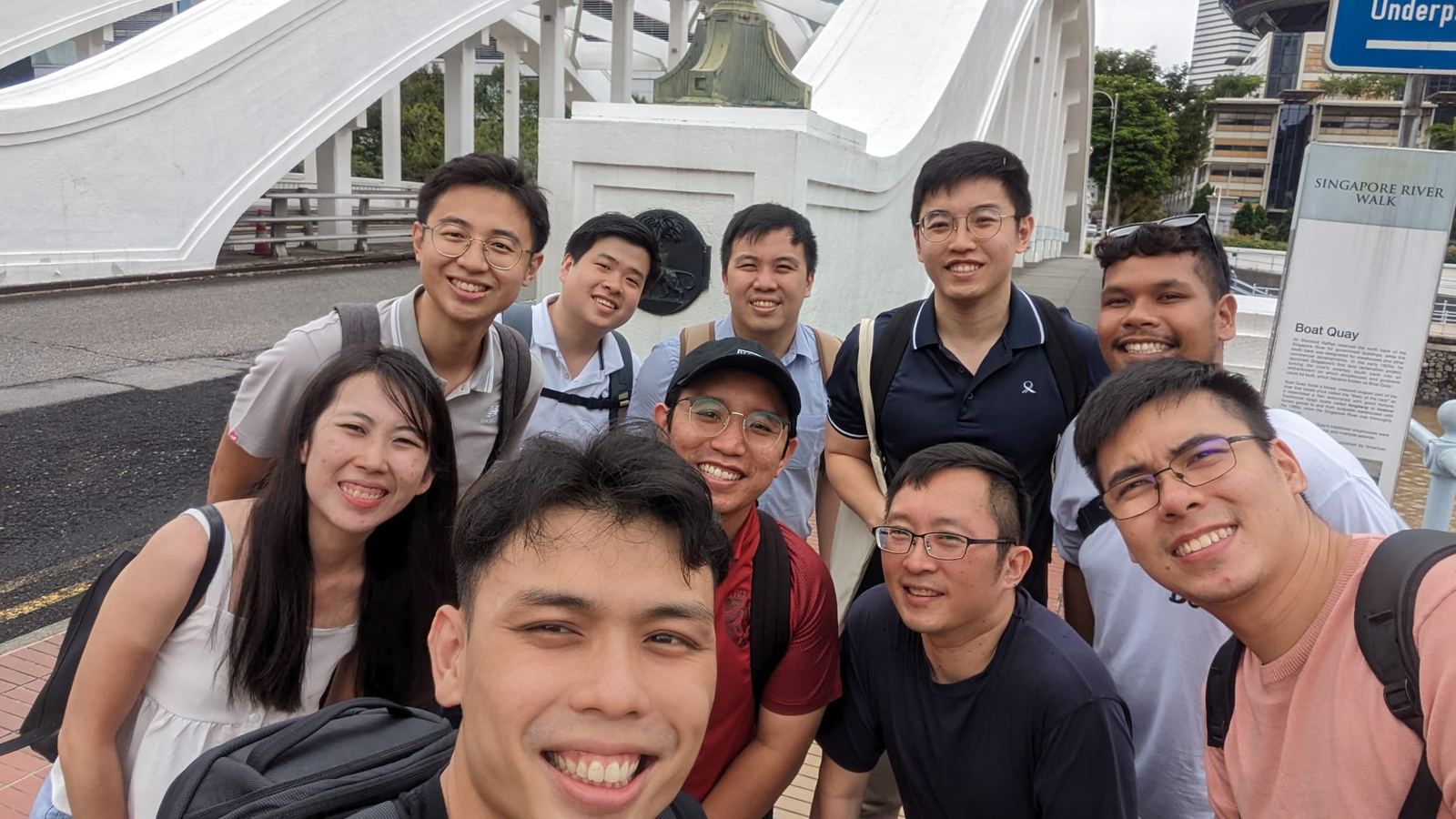 Team smiling together at an outdoor route checkpoint