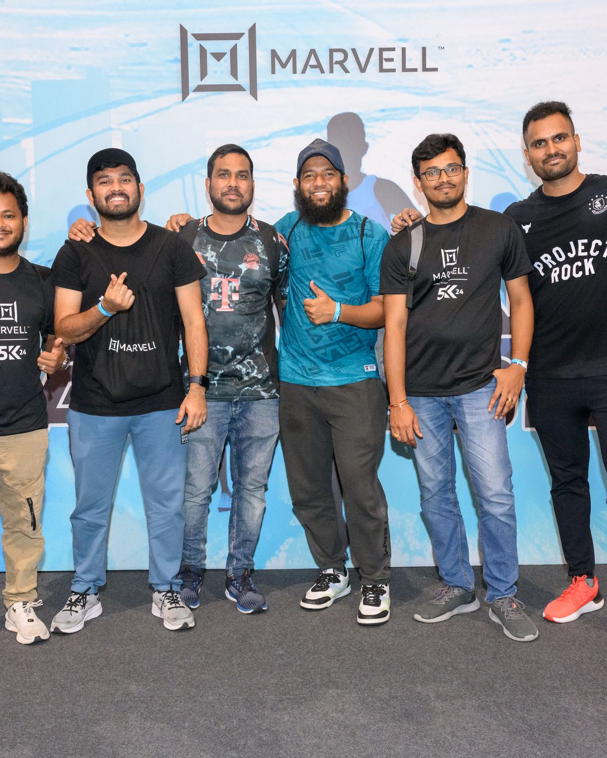 Corporate team posing together after an event checkpoint